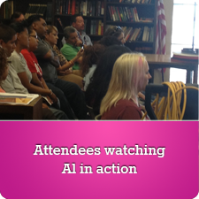 Attendees watching Al in action