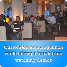Customers enjoying lunch while taking a break from watching demos