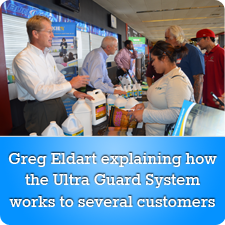 Greg Eldart explaining how the Ultra Guard System works to Several Customers
