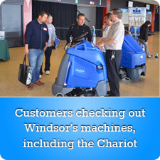 Customers checking out Windsor's machines, including the Chariot