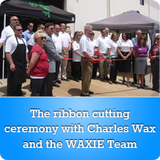 The ribbon cutting ceremony with Charles Wax and the WAXIE Team
