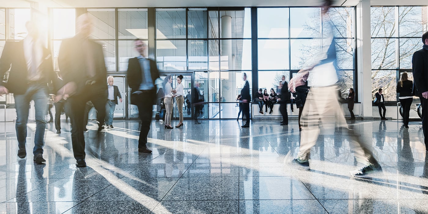 Blurred-Crowd-in-an-Open-Hall-wResilient-Flooring_583320193_1400x700