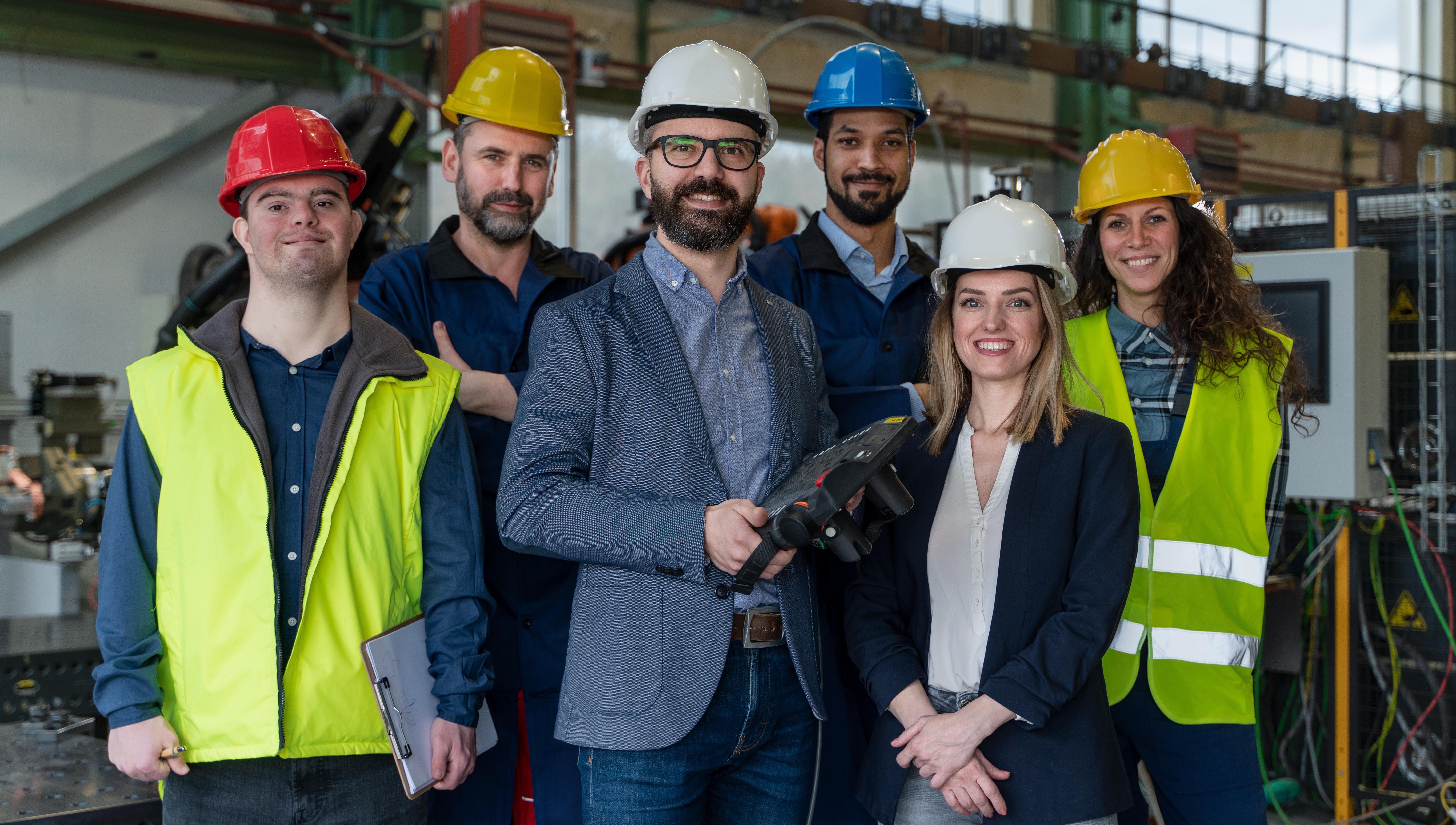 manager and other collegues working in industrial factory